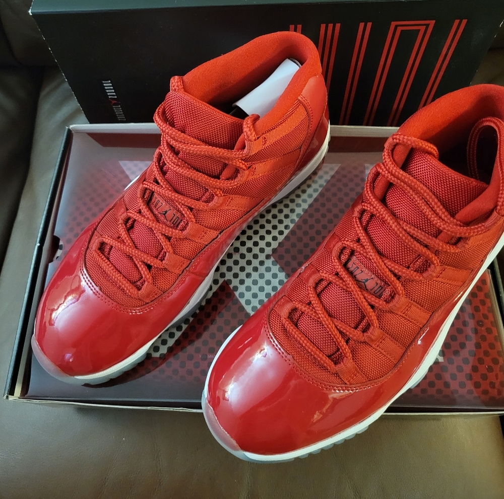 Air Jordan 11 Retro Red Athletic Sneakers.